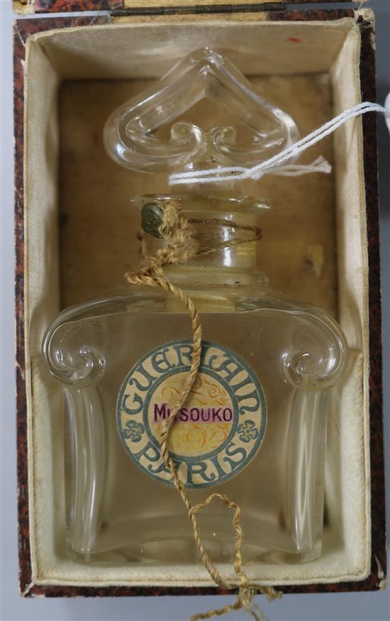 A Guerlain Mitsouko perfume bottle and box